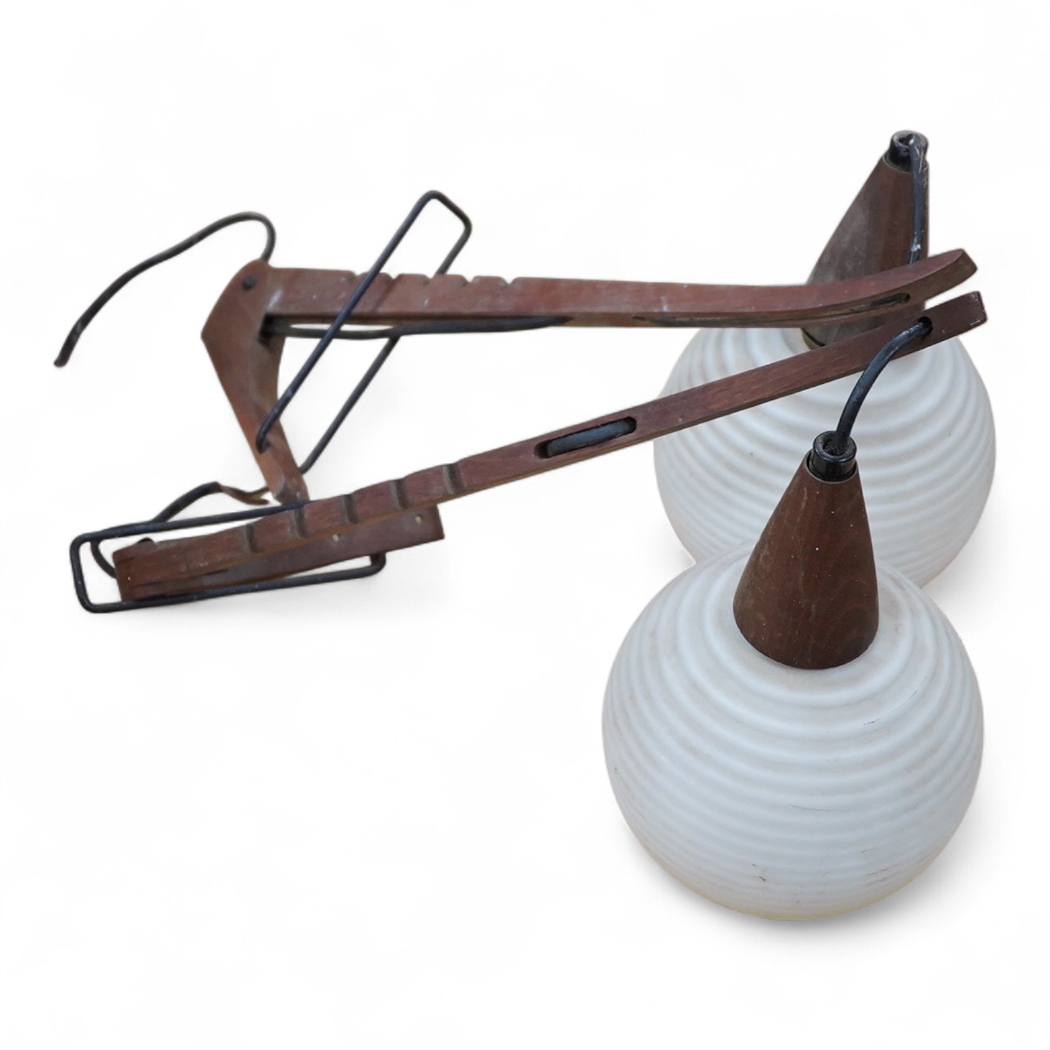 A pair of 1960s teak and opaque glass adjustable light fittings